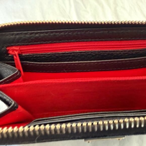 Dooney & Bourke Pebble Leather Black and Tan zip Wallet with Gold Accents - Picture 11 of 13